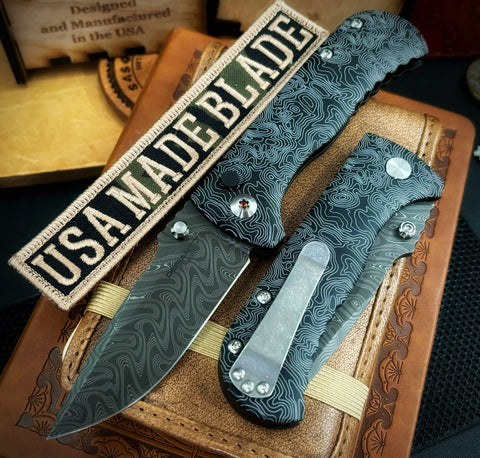 Topo Defiant-7 Talos Button Lock with Black Boomerang Stainless Chad Nichols Damascus Blade and Black Hardcoat Anodized Aluminum Handles