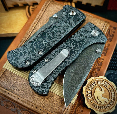 Topo Defiant-7 Talos Button Lock with Black Boomerang Stainless Chad Nichols Damascus Blade and Black Hardcoat Anodized Aluminum Handles