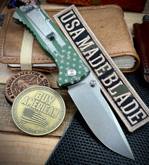 Defiant-7 Talos Button Lock Battled Stars & Stripes with Magnacut Blade and Green Hardcoat Anodized Aluminum Handles